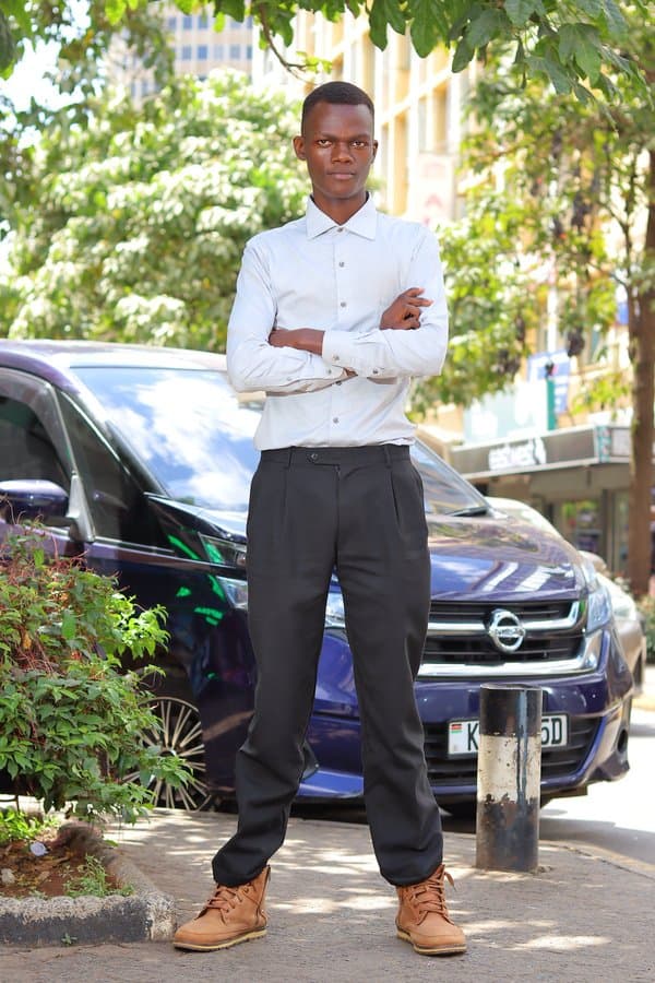 Mark Gakuya, Founder and CEO of AfriFoundry, standing on a street in Nairobi